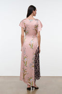 Pink floral long dress with short flutter sleeves, shown from the back.