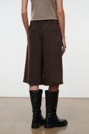 Dark brown shorts with elastic waistband and wide straight legs