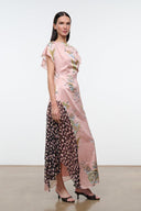 Pink floral maxi dress with flutter sleeves and sheer black side panel detail.