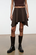 Dark brown skirt, above-knee length, asymmetric hem with frayed edges