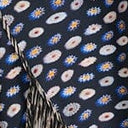 Silk skirt with navy base and multicolor dot pattern, asymmetric tiered hem