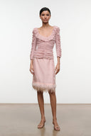 Sandrose pale pink ruched mini top with ruffle neckline, long sleeves, and fringe hem