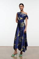 Navy silk midi dress with one-shoulder drape and gold floral tapestry print