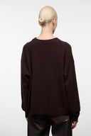 Dark chocolate cashmere sweater with ribbed crewneck and dog logo, back view