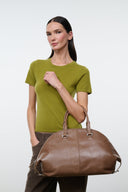 Brown leather satchel bag with two top handles and zip closure