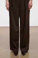 Dark brown ankle boots, pointed toe, worn with wide-leg dark trousers