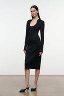 Black fitted midi sheath dress, long sleeves, scoop neckline, side profile