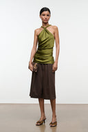 Fawn haircalf clutch with brown and tan speckled print, held in hand