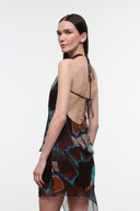 Printed sleeveless halter top with open back tie straps and draped front