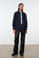 Indigo denim shirt jacket with button front, pointed collar, and long sleeves