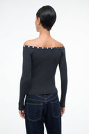 Dark gray off-shoulder sweater with long sleeves and row of silver buttons at back