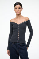 Off-shoulder dark gray sweater with long sleeves and vertical silver button closure