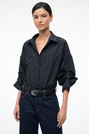 Black button-front bodysuit with pointed collar and long sleeves