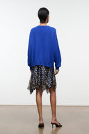 Silk skirt with navy multicolor dot print and uneven layered hem, back view