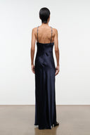 Back view of navy satin halter maxi dress with open back and beaded straps