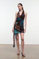 Short asymmetrical mini skirt with long sheer drape; dark brown butterfly print, teal and orange.