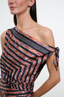 Silk dress bodice close-up, black rust and cream geometric stripes, draped asym neckline
