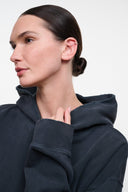 Dark washed-black terry hoodie with hood, high neckline, and front kangaroo pocket