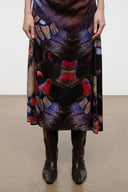 Dark espresso brown knee-high snake-embossed boot with low heel and narrow profile.