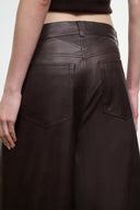 Dark brown leather culottes front pockets with stitched panel seams.