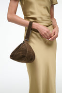 Demi shoulder bag in truffle brown on arm, open top, curved handle, suede-like texture