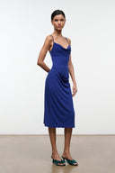 Midnight blue midi dress with cowl neckline and thin straps, side drape