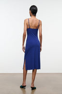 Midnight blue sleeveless midi dress with open back and thin spaghetti straps