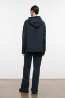 Washed black terry sweatpants back view, relaxed wide-leg silhouette