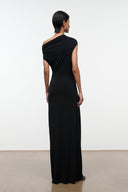 Black one-shoulder draped maxi dress, sleeveless, back view with floor-length skirt