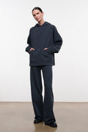 Dark washed-black hoodie with hood and kangaroo pocket, relaxed fit