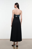 Black strapless evening dress with sequined teal-toned bodice and flared midi skirt