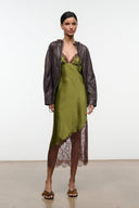 Silk slip dress in pear green with brown lace trim along neckline and hem