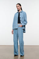 Sky-blue suede shirt with point collar, button front, long sleeves, chest patch pockets