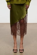 Espresso snake-print mule with open toe, slim heel, and braided bow detail