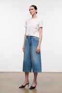 Light blue denim culotte jeans with mid-rise waist and stitched front pockets