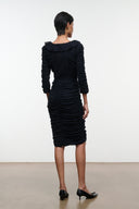 Black ruched midi dress with long sleeves and gathered back detail.