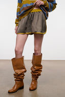 Dark gray side-view shorts with yellow trim and elastic waistband