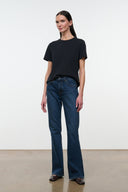 Front view of mid-rise dark-wash flare jeans with five-pocket styling