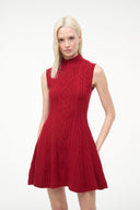 Red sleeveless sweater dress with textured cable-knit diamond pattern, high neck