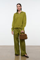 Mini carryall handbag in cigar-brown with rounded handles and snap-front pocket.
