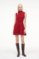 Red sleeveless knit sweater dress with diamond cable pattern and flared skirt