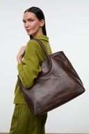 Dark brown distressed north-south tote with wide handles and roomy interior