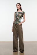 Side view of sleeveless printed top with green-gold butterfly motif and scoop neckline
