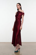 Deep burgundy silk midi dress with draped neckline and asymmetrical tie detail