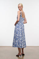 Blue toile print midi dress with thin straps and side view silhouette