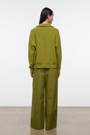 Mateo pants in pear green, back view with elastic waist and wide legs