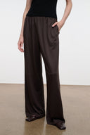 Dark oak wide-leg pants with elastic waistband and flowing full-length drape