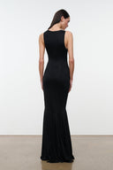 Black sleeveless maxi dress, back view with seam lines and flared skirt hem