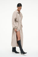 Black knee-high kitten heel boot worn with long coat