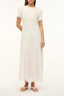 Buttercream coverup dress with short sleeves and fringe hem, relaxed shift fit
